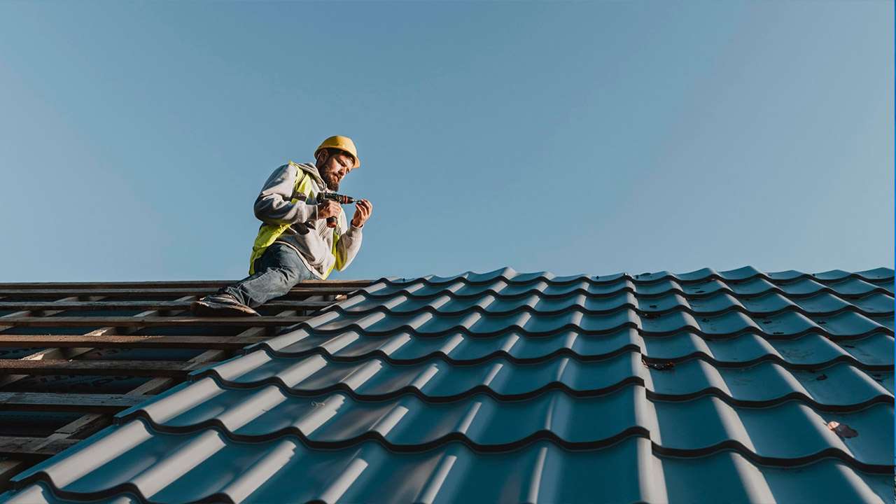 long-shot-man-working-on-roof_